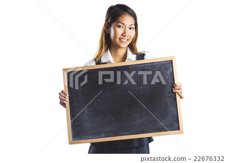 Smiling businesswoman holding a blackboard Smiling businesswoman holding a blackboard 22676332