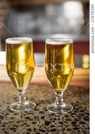 View of two pints of beer 22676389
