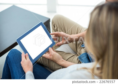 Couple using digital tablet 22676557