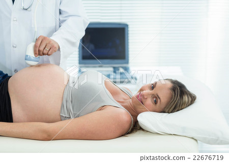 Pregnant woman receiving ultrasound treatment Pregnant woman receiving ultrasound treatment 22676719