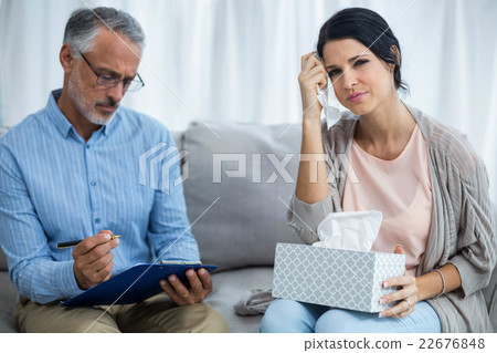 Therapist consoling a woman Therapist consoling a woman 22676848