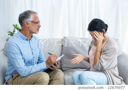 Therapist consoling a woman Therapist consoling a woman 22676977