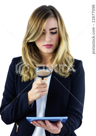 Woman using magnifying glass 22677096