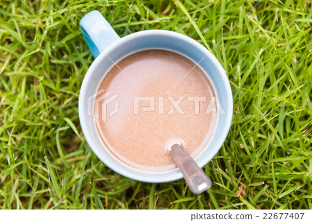Hot coffee on grass 22677407