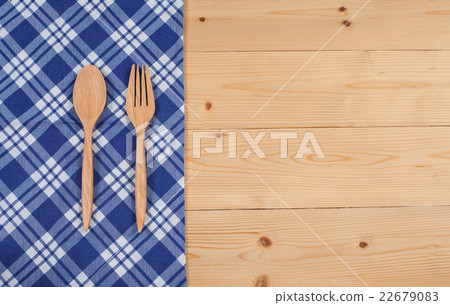 Tablecloth, wooden spoon, fork on wood textured Tablecloth, wooden spoon, fork on wood textured 22679083
