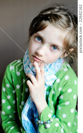 Indoor picture of diseased sad kid girl in scarf  22682162