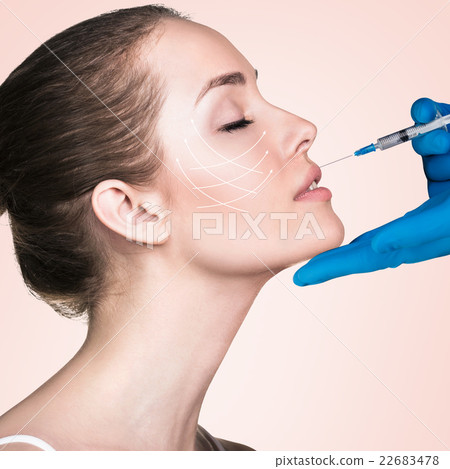 Beautiful woman gets an injection Beautiful woman gets an injection 22683478