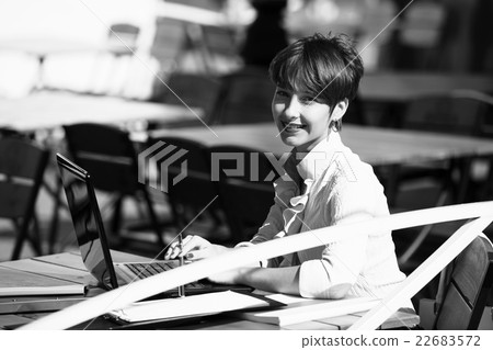 Attractive young woman using laptop Attractive young woman using laptop 22683572