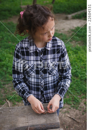 girl playing alone in the street 22684531
