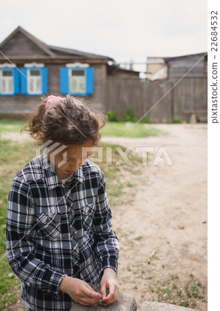 girl playing alone in the street 22684532