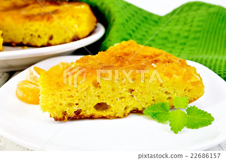 Pie mandarin with mint and green napkin on board Pie mandarin with mint and green napkin on board 22686157