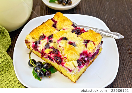 Pie with black currant in plate and fork on board Pie with black currant in plate and fork on board 22686161