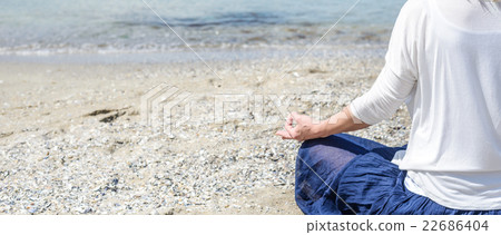 Woman meditating at the sea Woman meditating at the sea 22686404