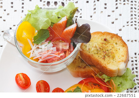 Crab stick cocktail salad in transparent glasses Crab stick cocktail salad in transparent glasses 22687551