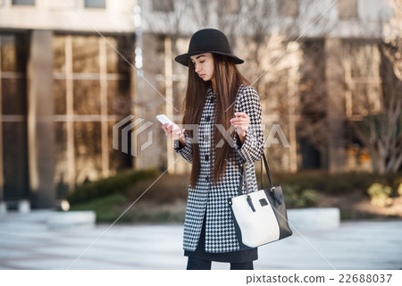 Beauatiful business woman using smartphone Beauatiful business woman using smartphone 22688037