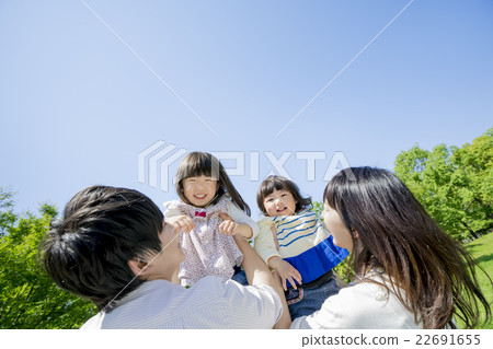 Four people playing in a fresh green park Four people playing in a fresh green park 22691655