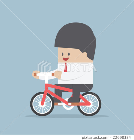 Businessman riding a bicycle to work 22698384