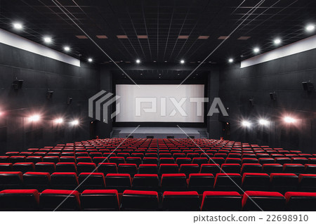 Empty rows of red theater or movie seats. Chairs 22698910