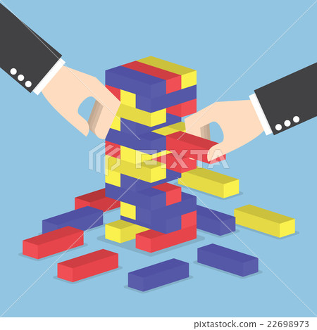 Businessman hands play wood block tower game Businessman hands play wood block tower game 22698973