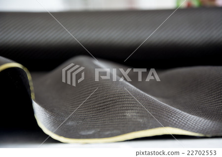 Carbon fiber composite raw material background 22702553