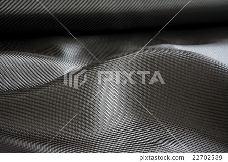 Carbon fiber composite raw material background 22702589