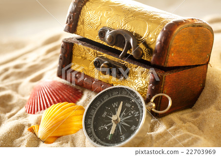 Treasure chest with seashells and compass Treasure chest with seashells and compass 22703969