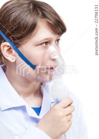 girl breathes with face mask of modern nebulizer girl breathes with face mask of modern nebulizer 22706131