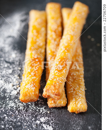 Cheese bread sticks on a slate background Cheese bread sticks on a slate background 22706709