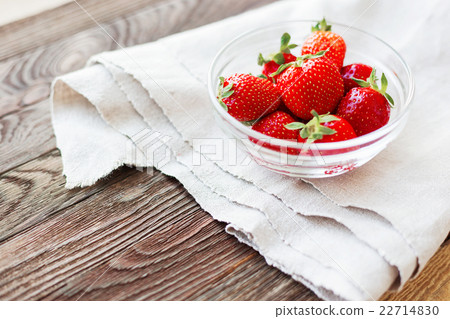 Fresh juicy strawberries in glass bowl.  22714830