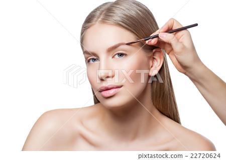 Woman correcting eyebrows form Woman correcting eyebrows form 22720624