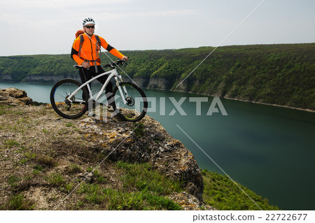 Young man is riding bicycle outside. Healthy Young man is riding bicycle outside. Healthy 22722677