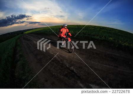 Young man is riding bicycle outside. Healthy Young man is riding bicycle outside. Healthy 22722678