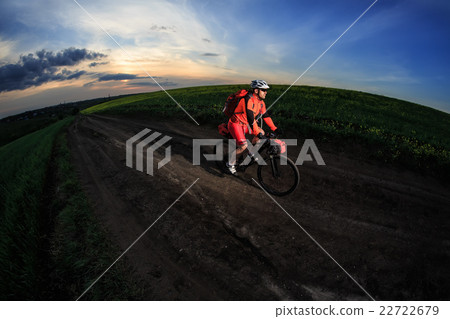 Young man is riding bicycle outside. Healthy Young man is riding bicycle outside. Healthy 22722679