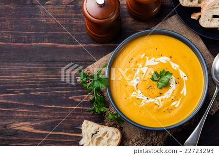 Pumpkin and carrot soup with cream and parsley Pumpkin and carrot soup with cream and parsley 22723293