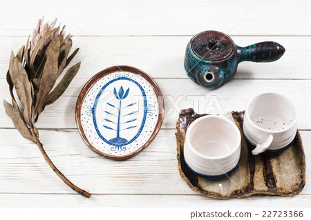 Close-up of clay tea set composition Close-up of clay tea set composition 22723366