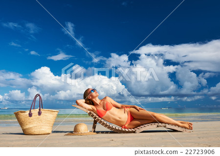 Woman in bikini lying on beach at Seychelles 22723906