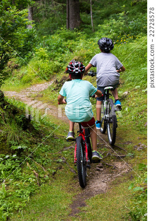 two kids on bikes two kids on bikes 22728578