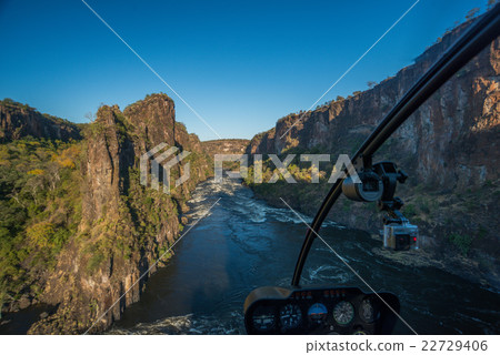 Aerial view from helicopter of sunlit gorge Aerial view from helicopter of sunlit gorge 22729406