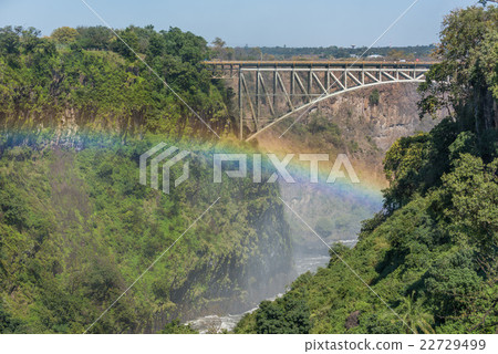Close-up of Victoria Falls Bridge over rainbow 22729499