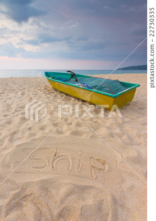 Small boat on the beach with sand sign for writing 22730335