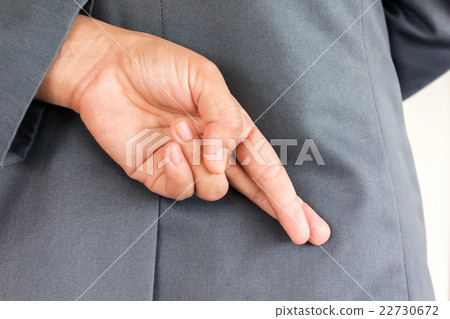 Making lie symbol finger hiden behind Making lie symbol finger hiden behind 22730672