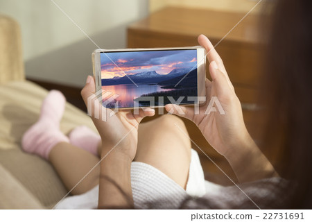 She was looking at the sights of Sweden on mobile  22731691