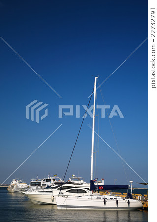 Yachts and sailboats moored in marina. Yachts and sailboats moored in marina. 22732791