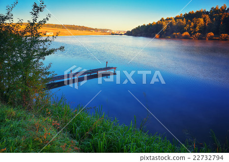 Wooden dock, pier, on a lake Wooden dock, pier, on a lake 22732794