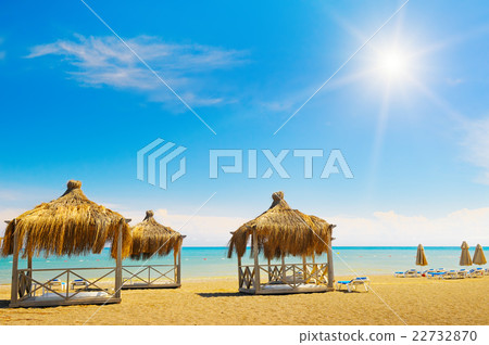sandy beach, awnings and sunbeds sandy beach, awnings and sunbeds 22732870