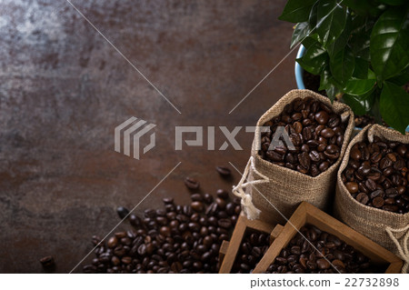 Jute bags and wooden containers with cofee beans Jute bags and wooden containers with cofee beans 22732898