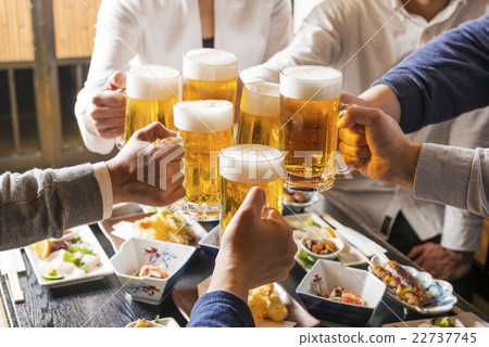 A man toasting in a pub A man toasting in a pub 22737745