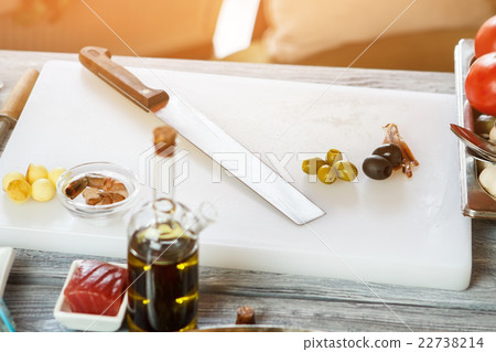 Olives on white cooking board. 22738214