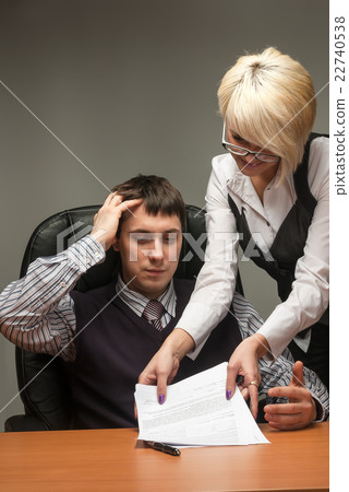 Elegant secretary and boss work with documents 22740538