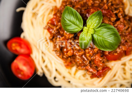 Spaghetti bolognese on dark background Spaghetti bolognese on dark background 22740698